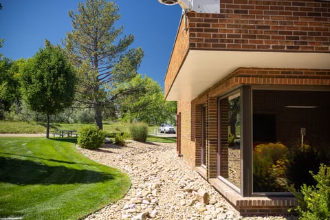 Commercial property maintenance rock flower bed