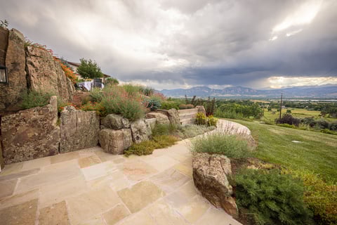 Residential landscape design back of house patio walkway view