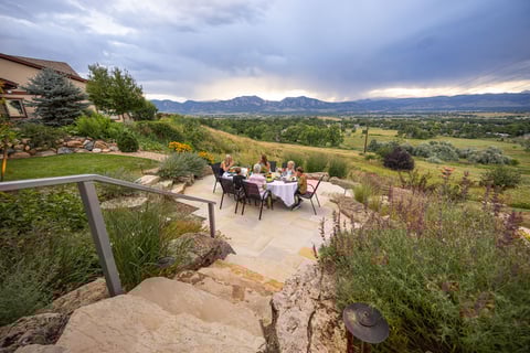 Residential landscape design clients eating on patio 1