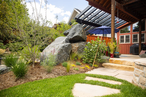 Residential landscape design small backyard large boulders