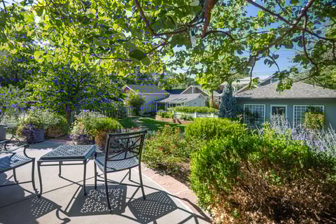 Residential landscape design with backyard seating and landscape beds